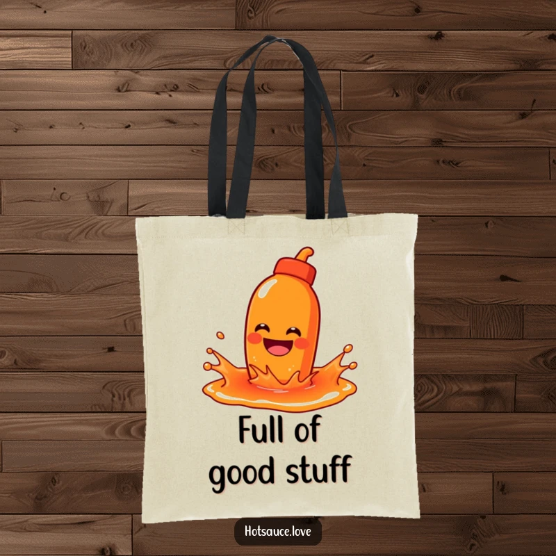 Funny tote bag showcasing a hot sauce character with a wide grin playfully splashing in a puddle of sauce.